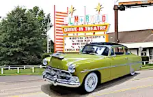Completed build superimposed in front of a drive-in theatre