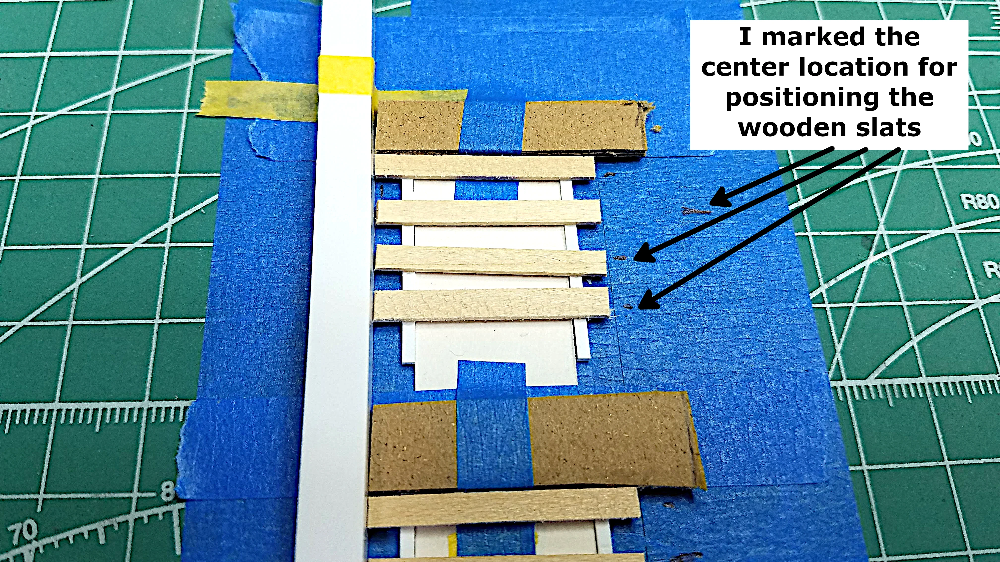 Marking where the other slats should be placed
