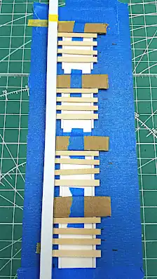 Marking where the other slats should be placed