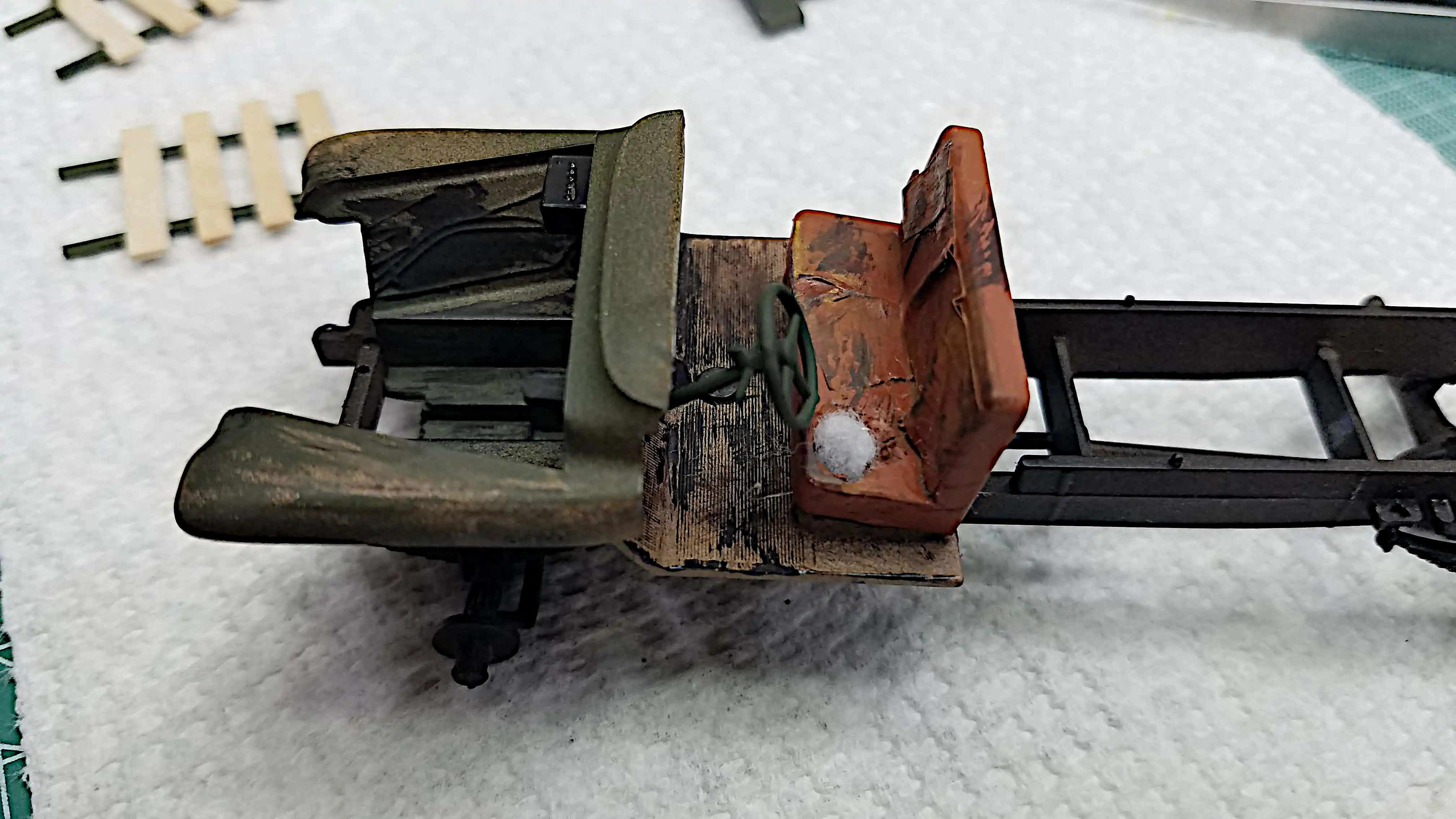 Interior floor, seat and front fender assembly installed