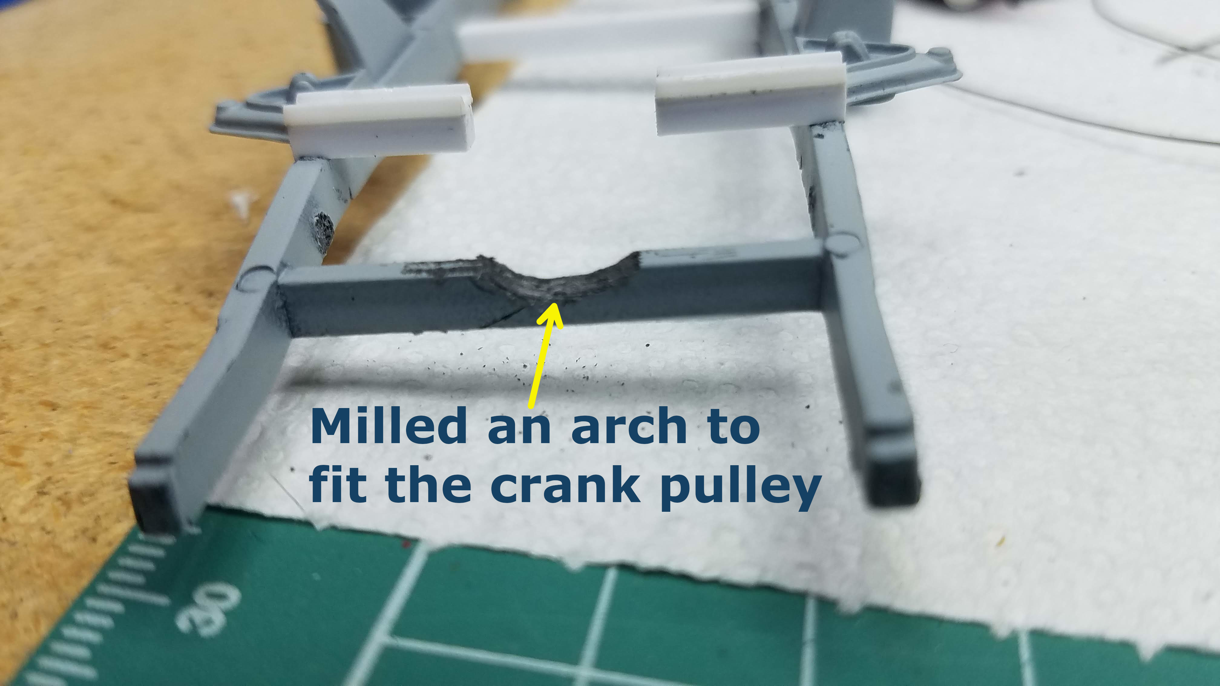 Front frame cross member cut out to allow the crank pulley to clear the frame