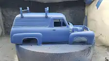 First coat of body color applied to body