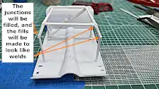 Scratch built roll cage on floor pan, front view