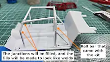 Scratch built roll cage on floor pan, left side