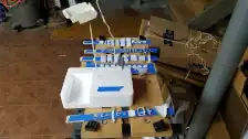 Parts from two kits being primed