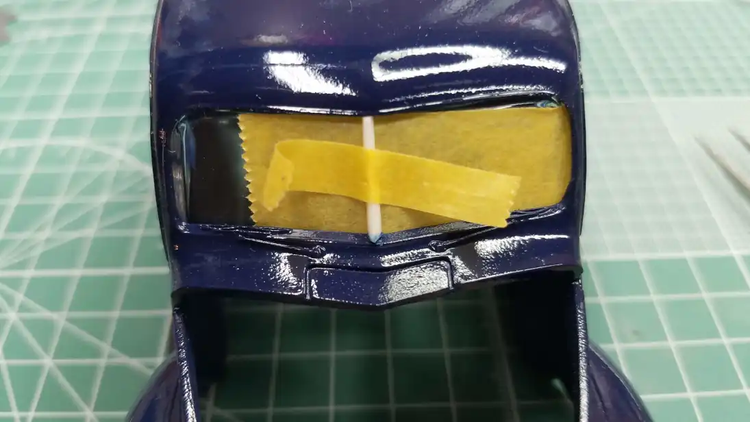 Taping the windshield center divider in place