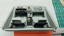Closeup of dashboard after small alarm clock has been installed