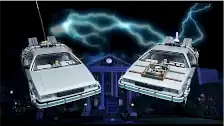 Both DeLoreans side-by-side with lightening bolt in background